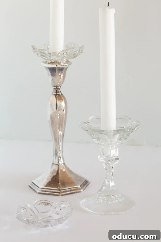 Simple Steps to Gorgeous Christmas Taper Candle Rings 3 Two elegant candlestick holders adorned with glass bobèches, designed to catch wax drips while enhancing the festive ambiance.
