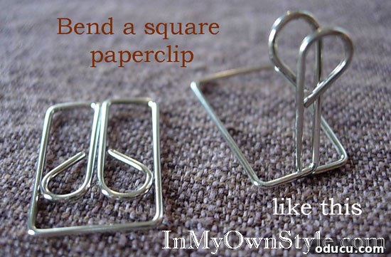 Showcase Your Holiday Cards: DIY Mantel & Table Display 8 Detailed instructions on how to open an owl style paper clip for use as a card holder.