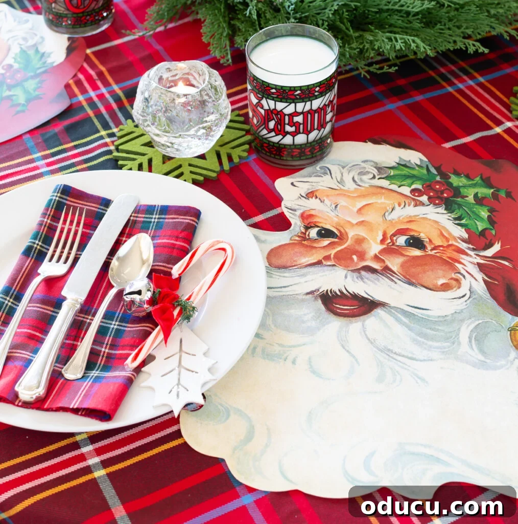 Joyful and Merry Christmas Dinner Table 4 Close-up of a charming Santa face paper placemat by Hester and Cook, highlighting its vintage appeal and quality for a festive Christmas dinner.