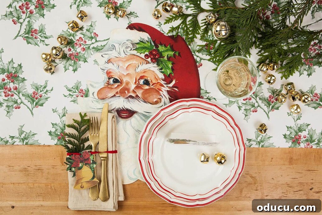 Joyful and Merry Christmas Dinner Table 9 Vintage Santa face paper placemat on a table with a subtle holly pattern tablecloth, showing a classic placement style for Christmas dinner.