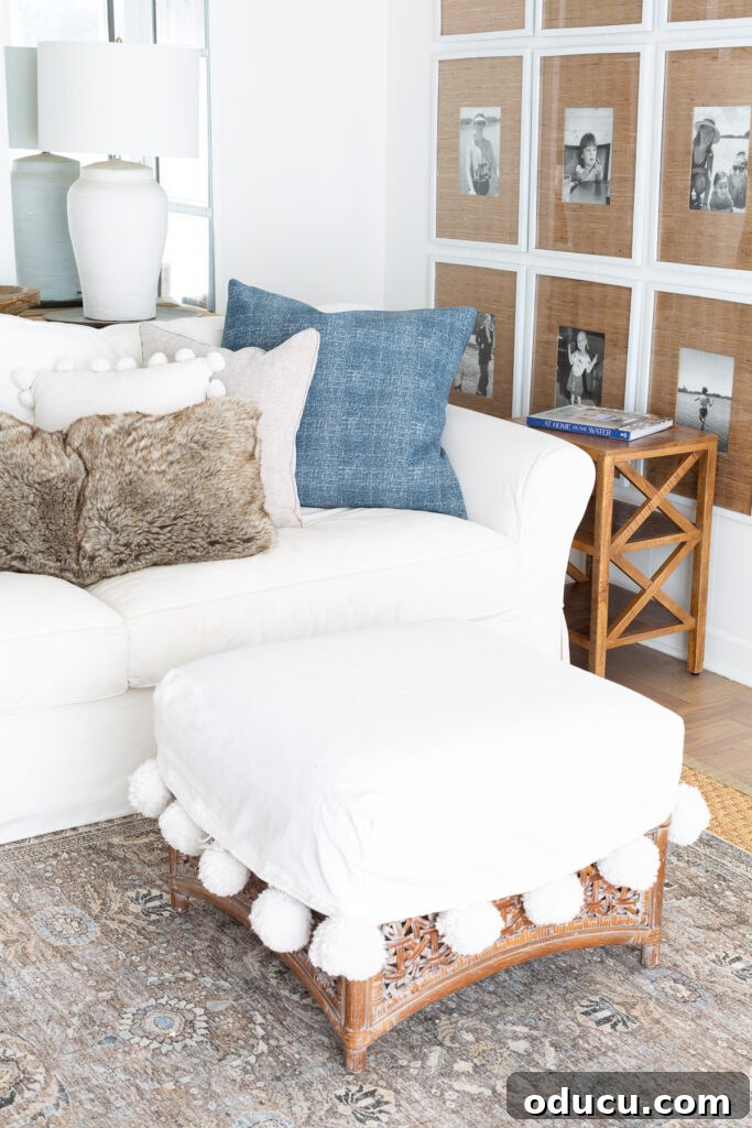 Effortless Winter Decor 2 Cozy living room corner adorned with blue and white accents, complemented by warm fur throws, creating a serene winter ambiance.