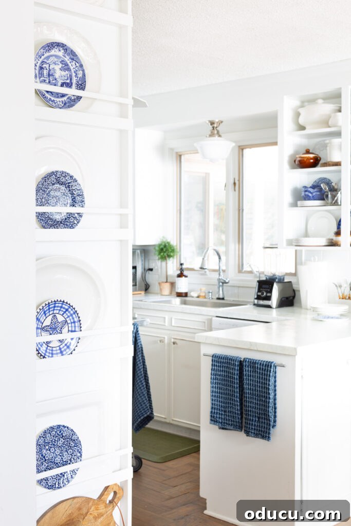 Effortless Winter Decor 10 Detail shot of a white kitchen with elegant blue accents, showcasing a cohesive and refreshed design without major changes.