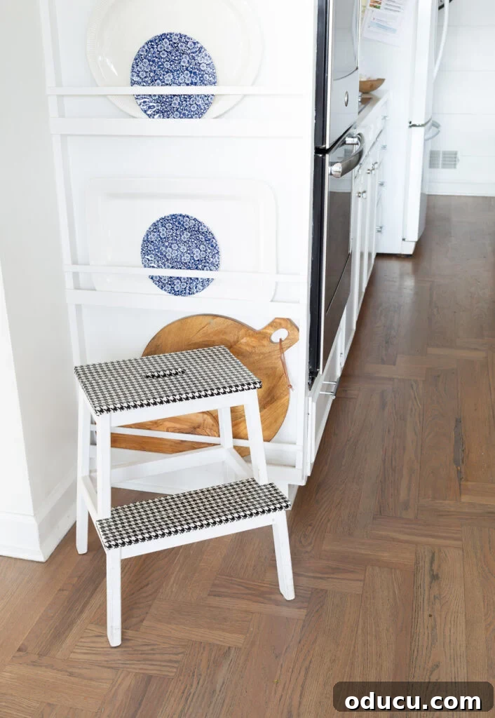 The Unsung Hero Your Home's Must-Have Small Furniture 2 IKEA Bekvam Step Stool painted white with black and white houndstooth duck tape covering the steps.