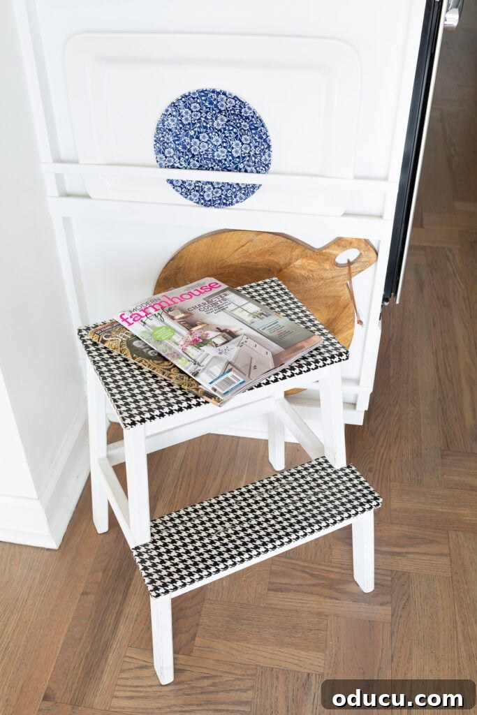 The Unsung Hero Your Home's Must-Have Small Furniture 11 IKEA Bekvam Step Stool painted white with black and white houndstooth duck tape covering the steps.
