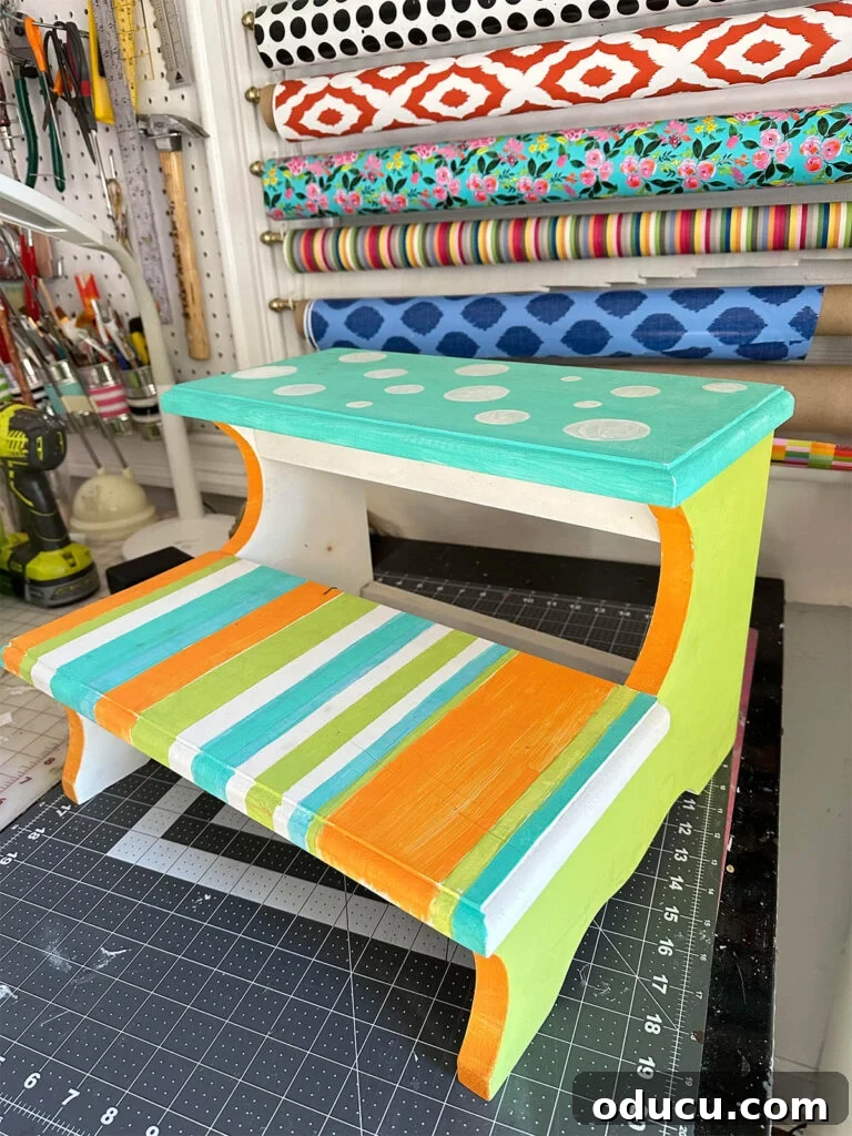 The Unsung Hero Your Home's Must-Have Small Furniture 4 Thrift store find wood step stool painted in neon colors, stripes and dots waiting for a makeover.