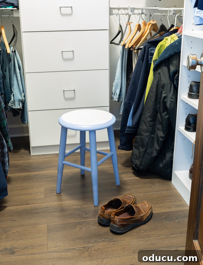 The Unsung Hero Your Home's Must-Have Small Furniture 9 19" high round wood stool painted light blue and white in a clothes closet to sit on so you can put on shoes.