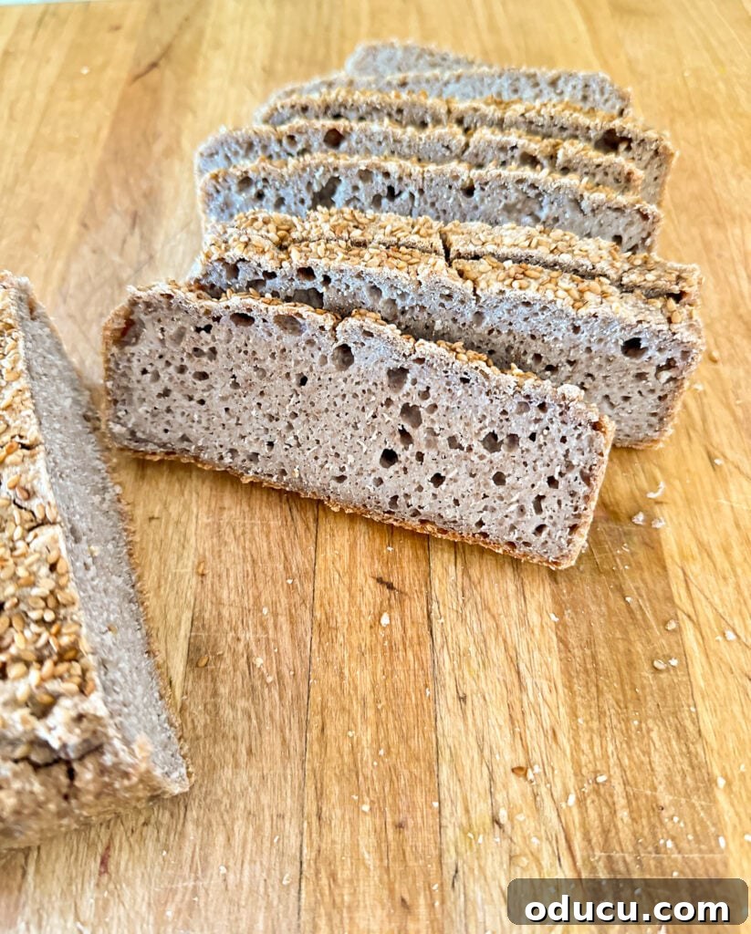 Buckwheat Toast Your Deliciously Wholesome Go To Snack 3 Perfectly baked slices of homemade buckwheat bread displaying a rich, nooky texture, arranged for presentation.