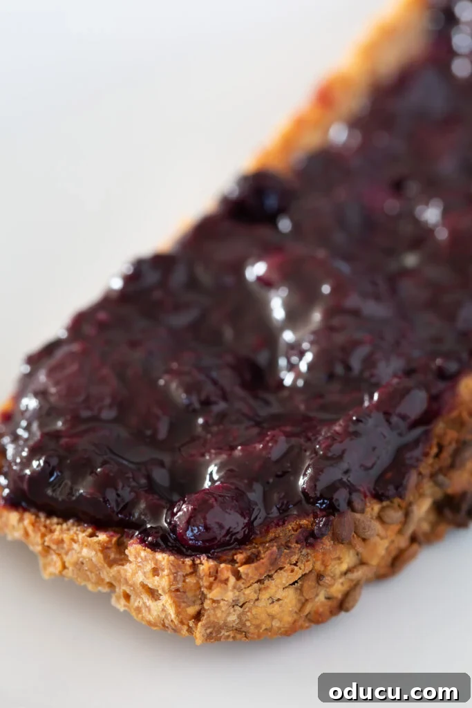 Buckwheat Toast Your Deliciously Wholesome Go To Snack 6 A close-up of healthy, no-sugar berry jam spread over a crunchy slice of nutritious buckwheat toast.