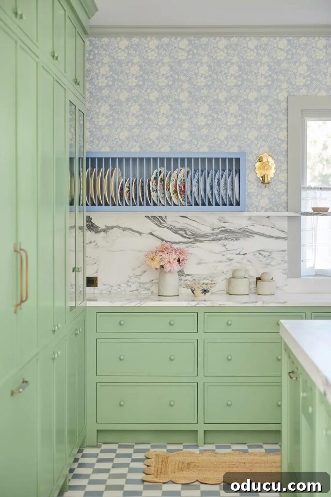 Fashion Field Notes 180 2 Green and blue kitchen with a large island and vibrant decor