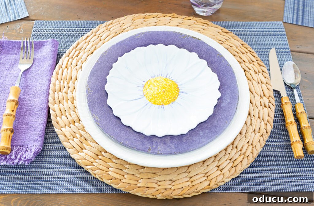 Effortless Easter Table Decor and Centerpiece Ideas 7 Decorate Easter table place settings with layered plates, including a plate charger for added dimension.