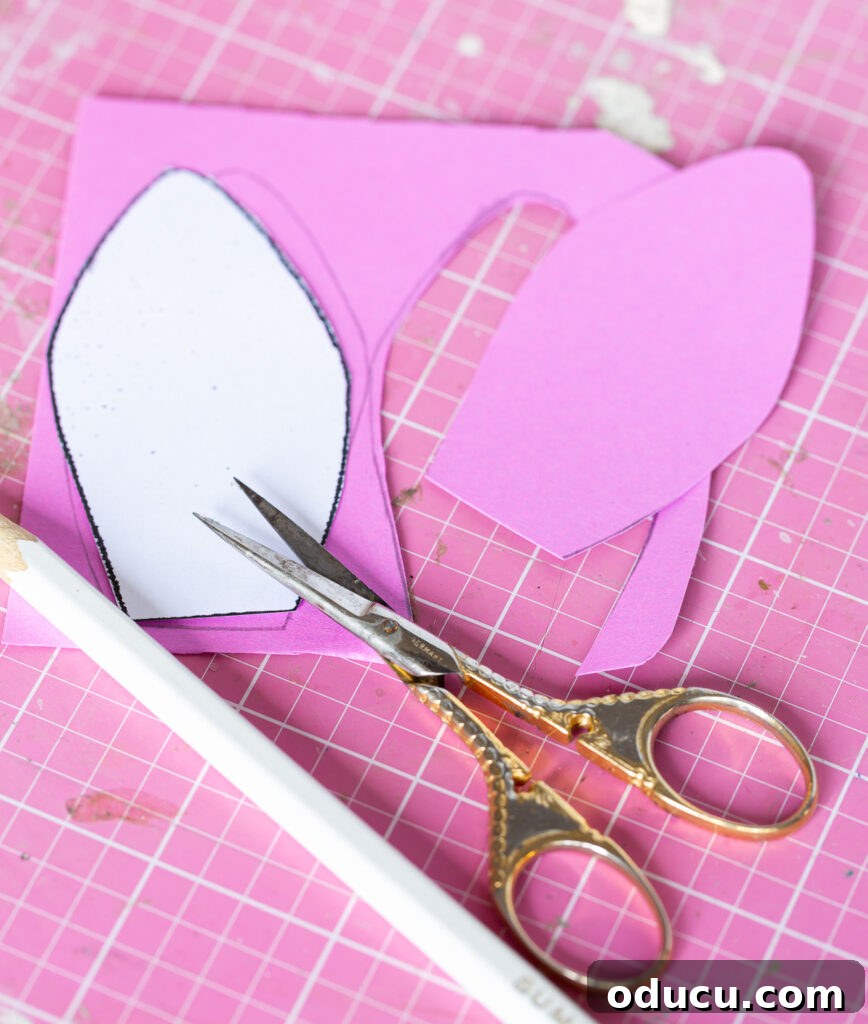 Craft Adorable Easter Bunny Gift Bags 9 How to trace bunny ear template pattern on paper to make pink inside section of bunny ears.