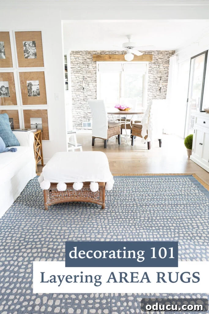 Elevating My Living Room with Area Rugs 13 A beautifully decorated living room demonstrating the effective technique of layering area rugs for enhanced style and comfort.