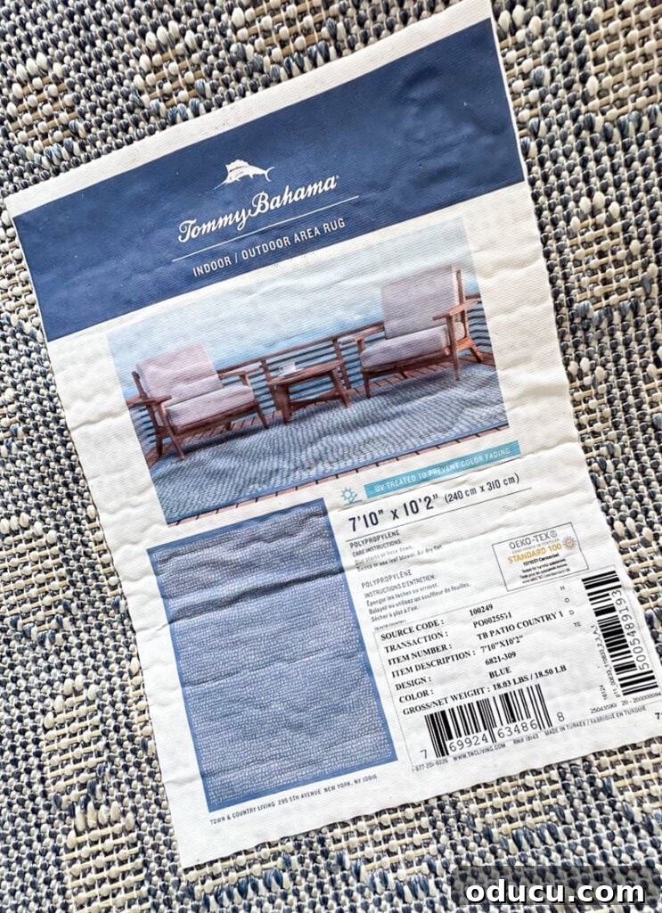 Elevating My Living Room with Area Rugs 7 Close-up of a Tommy Bahama area rug label, indicating brand and style.