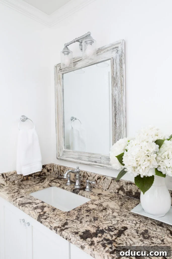 Primary Bathroom Sanctuary Unveiled 16 bathroom sink area in newly redecorated primary bathroom in a home.