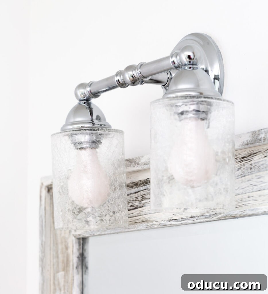 Primary Bathroom Sanctuary Unveiled 17 crackle glass and polished chrome bathroom light fixture.