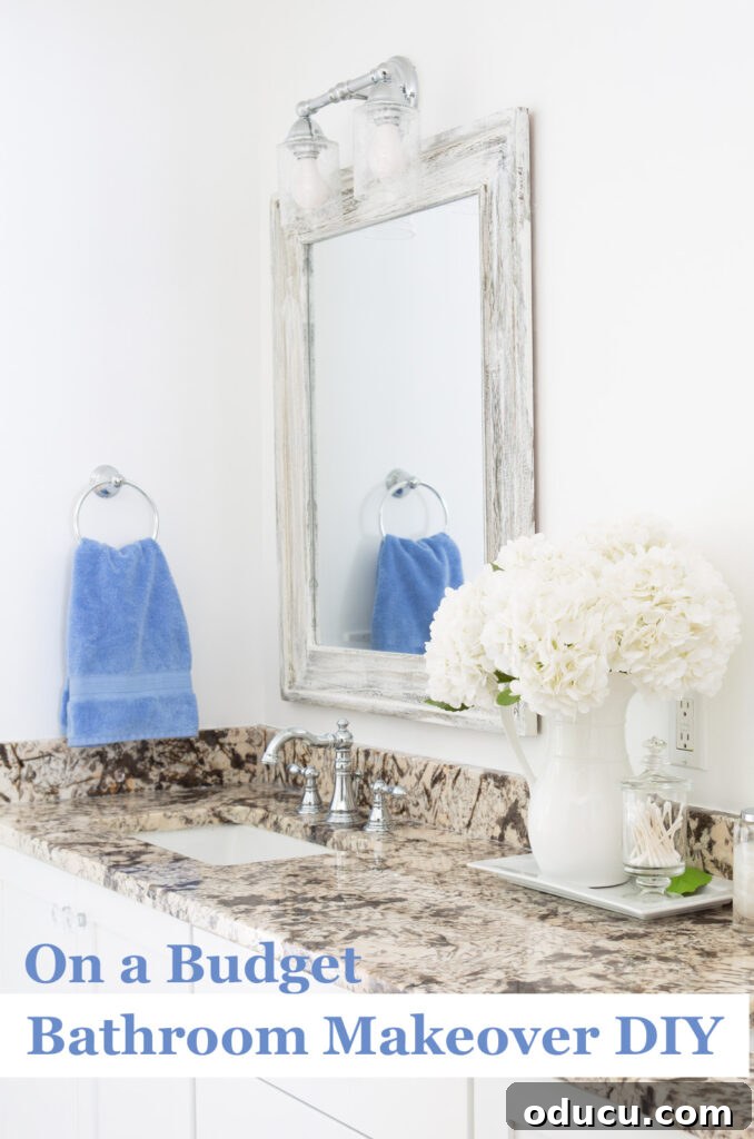 Primary Bathroom Sanctuary Unveiled 26 On a budget Bathroom makeover DIY white/neutral after with a color pop of sky blue.