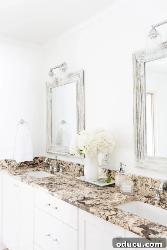 Primary Bathroom Sanctuary Unveiled 5 white flowers on bathroom counter