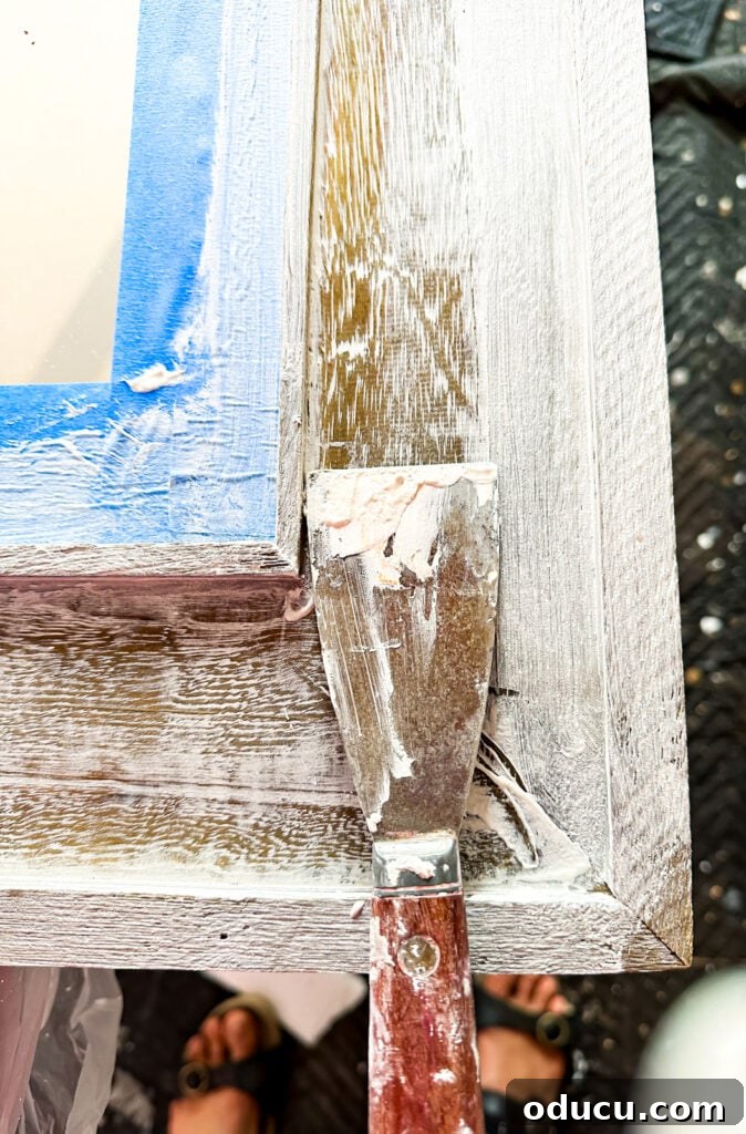 Unconventional Furniture Finishes Beyond Paint or Stain 14 Applying Amy Howard Vintage plaster over a raw wood frame on a mirror.