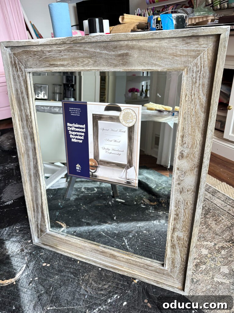 Unconventional Furniture Finishes Beyond Paint or Stain 10 Large wall mirror with a rustic wood frame leaning against saw horses.