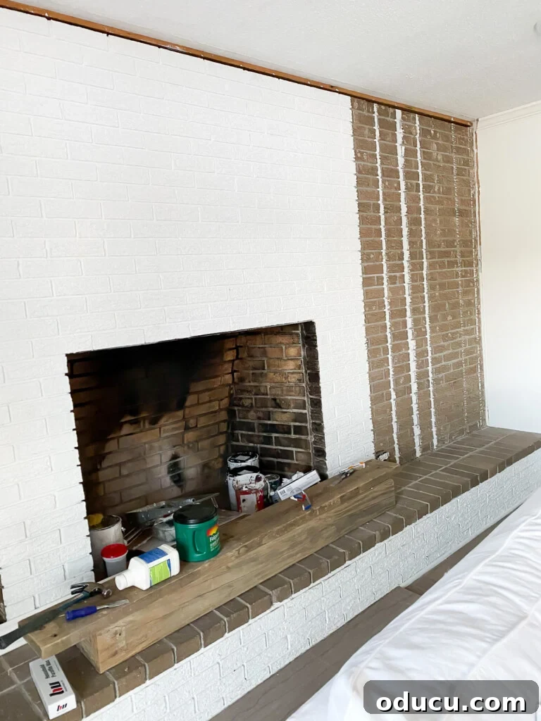 The Ever-Evolving Hearth 11 Fireplace wall getting a fresh coat of white paint