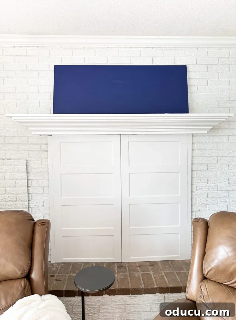 The Ever-Evolving Hearth 16 Face-on view of a white brick fireplace wall and mantel without anything on it, ready for decoration.