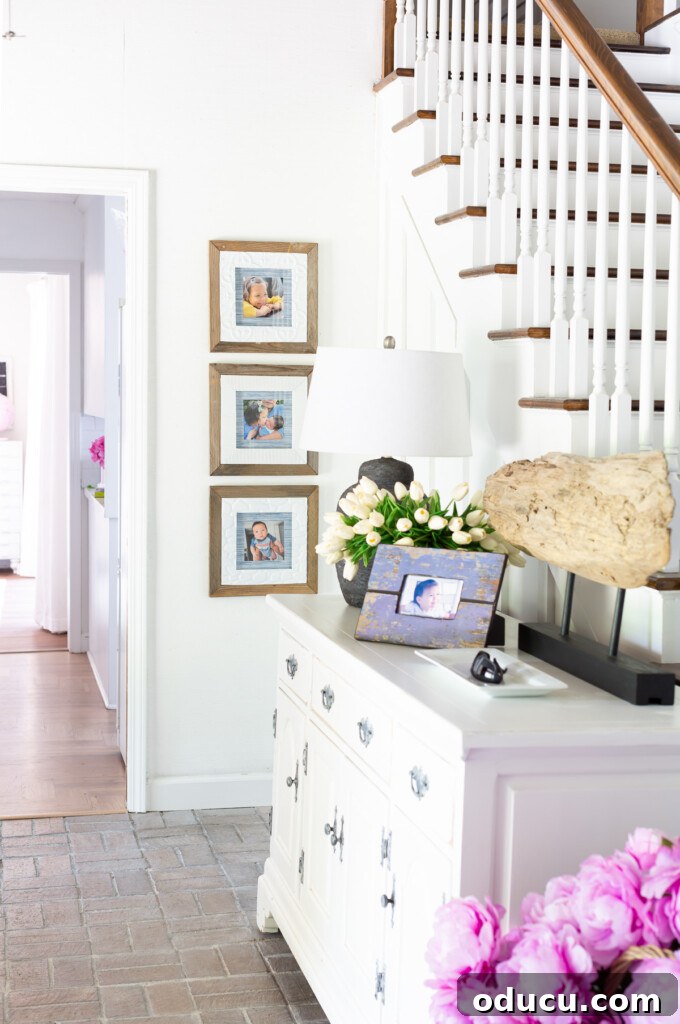 The Ever-Evolving Hearth 5 Display family pictures wall ideas in a foyer.