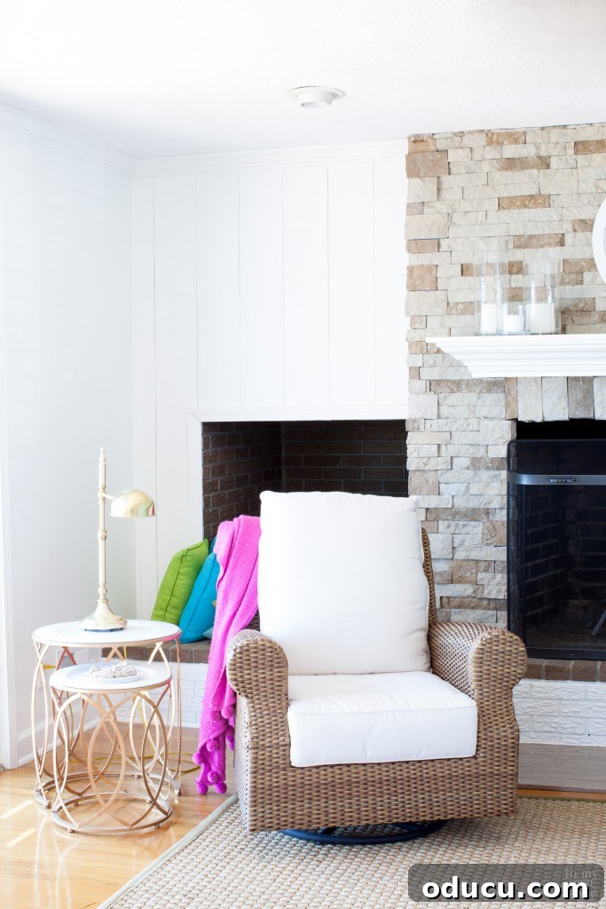 The Ever-Evolving Hearth 7 Airstone fireplace in living room with glossy white trim and vertical panels to accent on either side