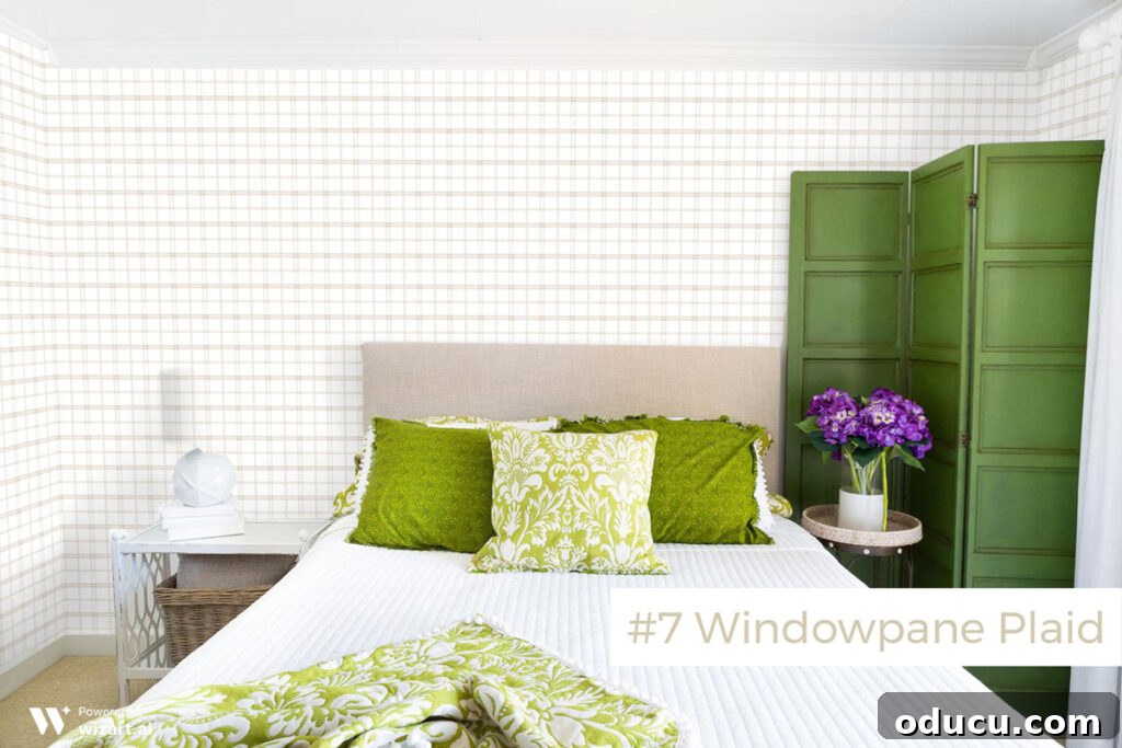 Chic Comfort for Guest Room One 15 #7-Windowpane-plaid wallpaper sample on wall. A sophisticated Windowpane Plaid wallpaper sample showcased on a wall for interior design inspiration.