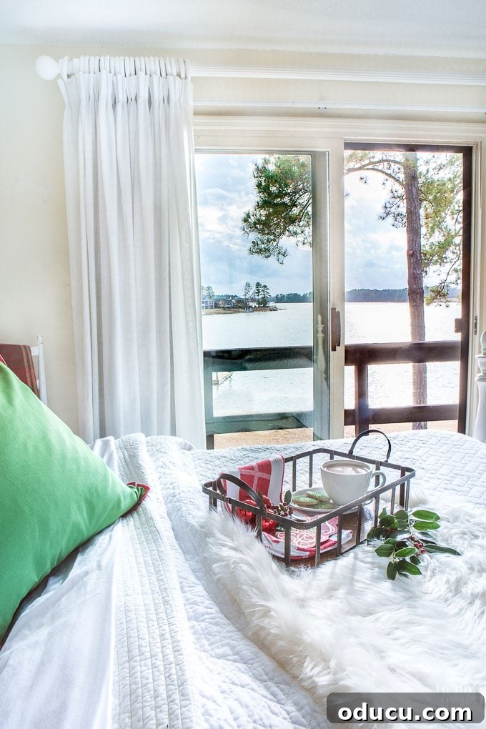 Chic Comfort for Guest Room One 3 Holiday ready guest room with lake view. A serene bedroom design showcasing a beautiful lake view, perfect for holiday visitors.