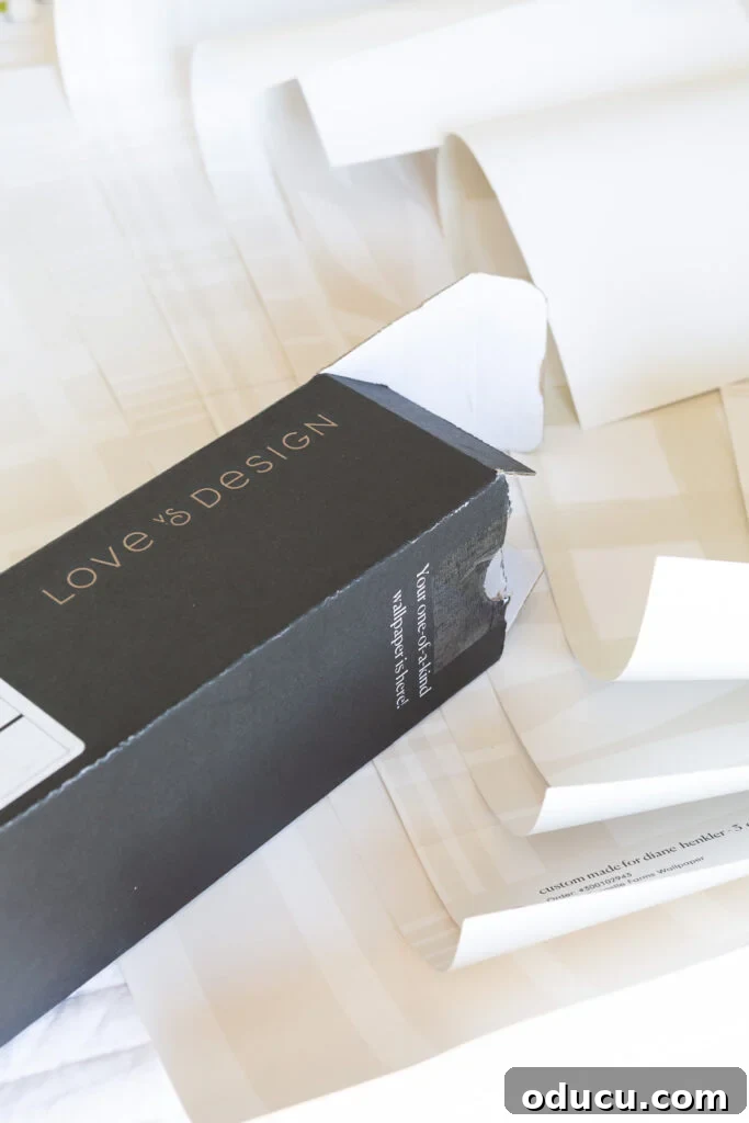 Chic Comfort for Guest Room One 5 Opening box of customized wallpaper from Love & Design. Excitedly unboxing personalized wallpaper samples for home decor.