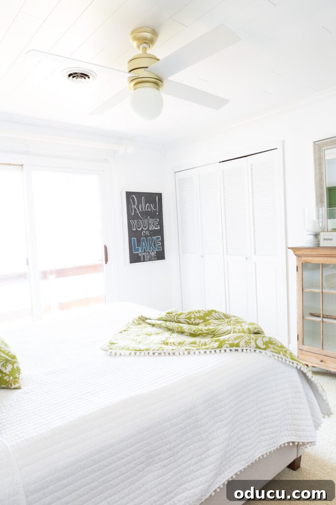 Chic Comfort for Guest Room One 9 White wall guest room in bright sunlight. A bright and airy guest room with a pristine white wall, bathed in natural sunlight, highlighting potential for design.