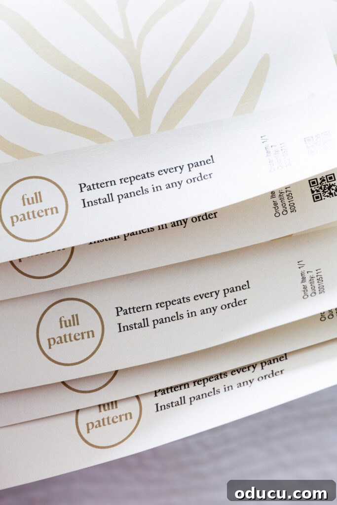 Walls of Welcome 11 Neatly stacked Love vs Design Glissade wallpaper panels, ready for installation and ensuring the correct order for a seamless pattern match.