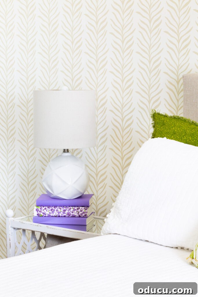 Walls of Welcome 7 A serene bedroom setting featuring a beautifully patterned accent wall from Love vs Design, adding subtle elegance and texture to the space.