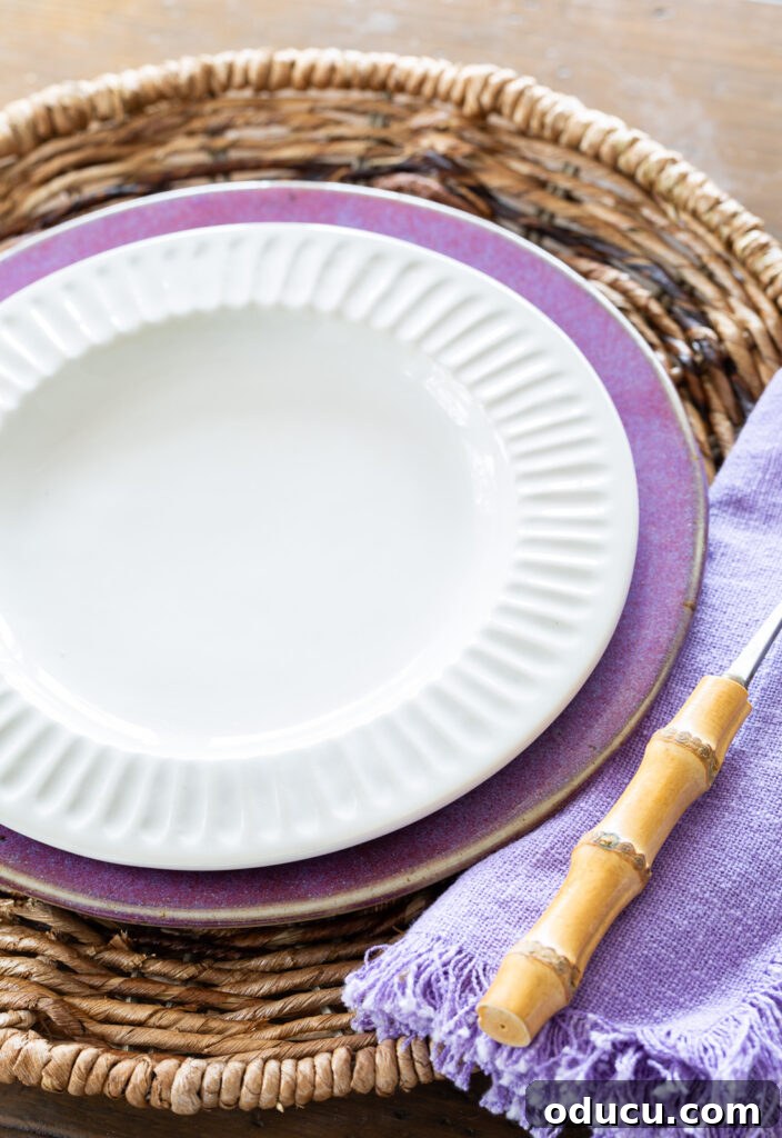 Hold Off on Fall Decorating Try This Alternative 15 white ridged dinner plate from McGee & Co on top of a purple plate from a thrift store.