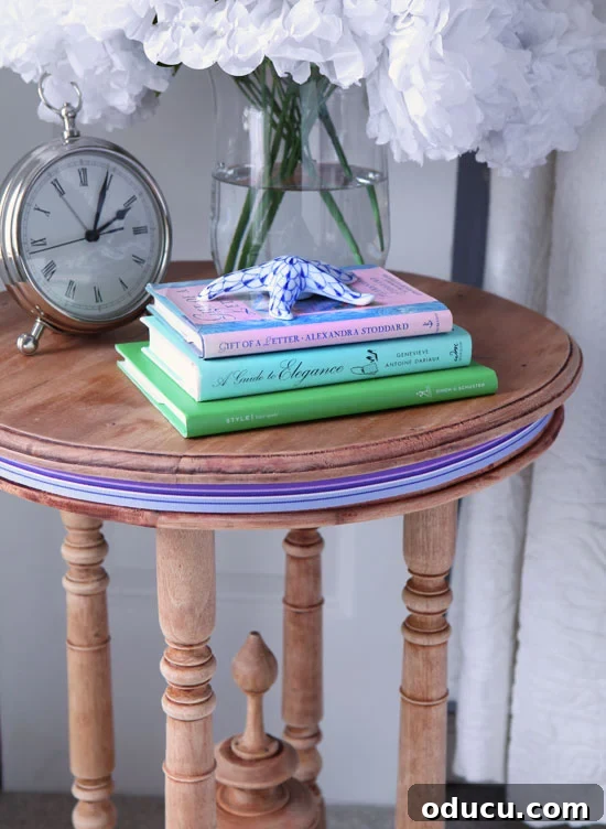 Hold Off on Fall Decorating Try This Alternative 17 a stripped side table with striped ribbon around the top as a decorative accent.