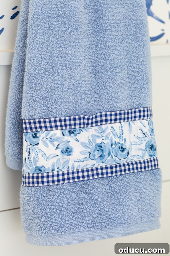 Hold Off on Fall Decorating Try This Alternative 21 close up of a blue towel with ribbon and fabric added to it to make it more interesting and to coordinate with the decor.