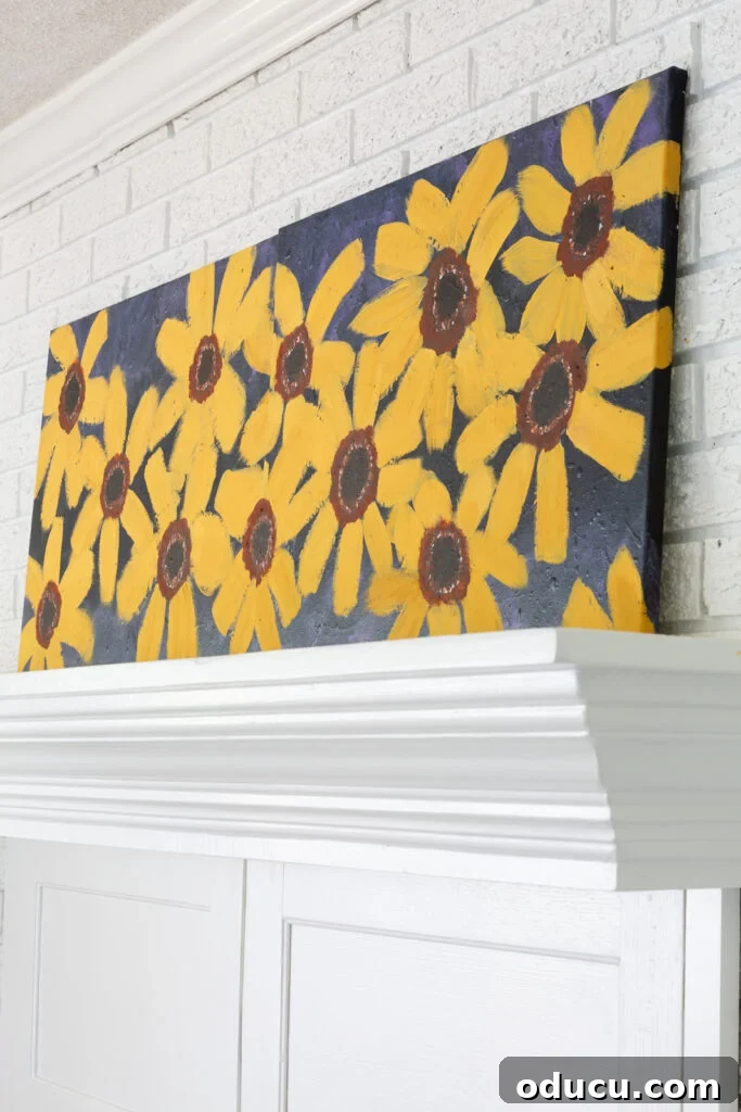 Cozy Autumn Vibes: Living Room Refresh 6 Close up of fall flowers painted on two large canvases that are placed side by side on a mantel.