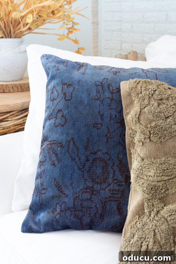 Creative Dyeing for Fabric Decorations 6 Two Fall colored throw pillows lined up on a white sofa.
