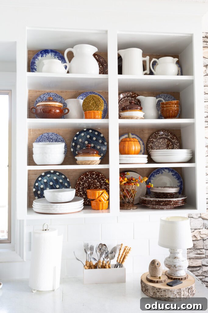Fall Kitchen Shelves Get a Wallpaper Makeover 7 kitchen shelf styling ideas using wallpaper and your favorite dishes and serveware.