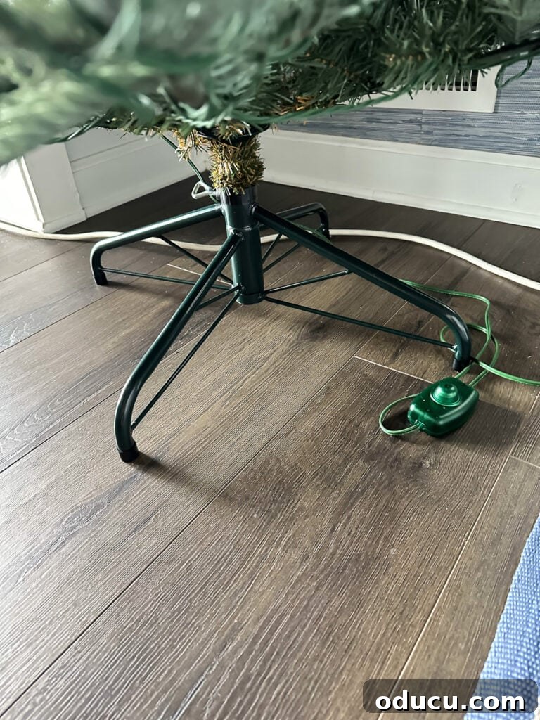 The King of My Christmas 5 King of Christmas tree stand and on/off foot button for lights.