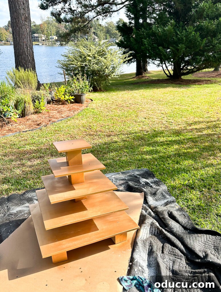Adventures in Life and Home 14 A wedding cupcake stand being expertly painted with a shimmering gold finish.
