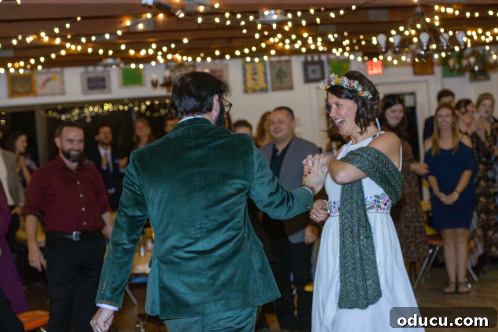 Mandy Ties the Knot 19 bride and groom dancing under twinkle lights.