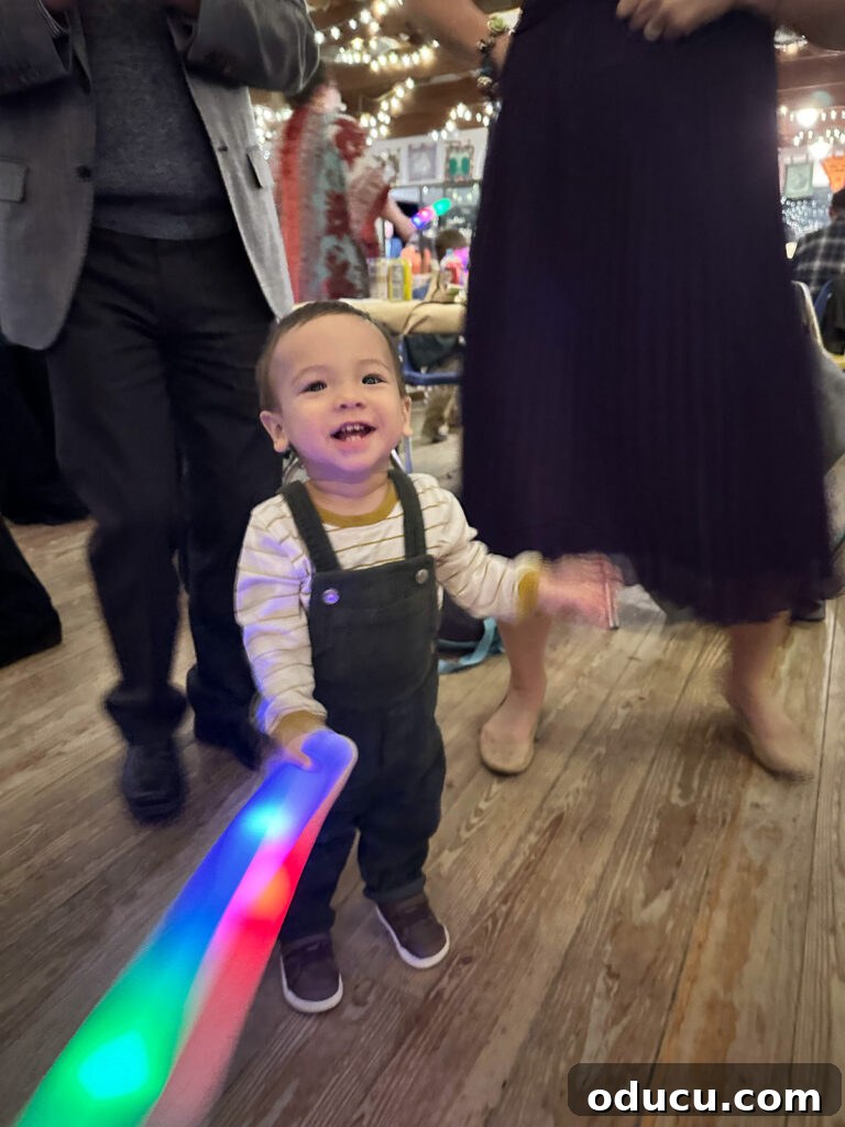 Mandy Ties the Knot 22 Grandson dancing with foam glow stick