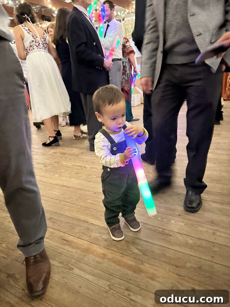 Mandy Ties the Knot 23 Grandson playing with foam light up glow sticks