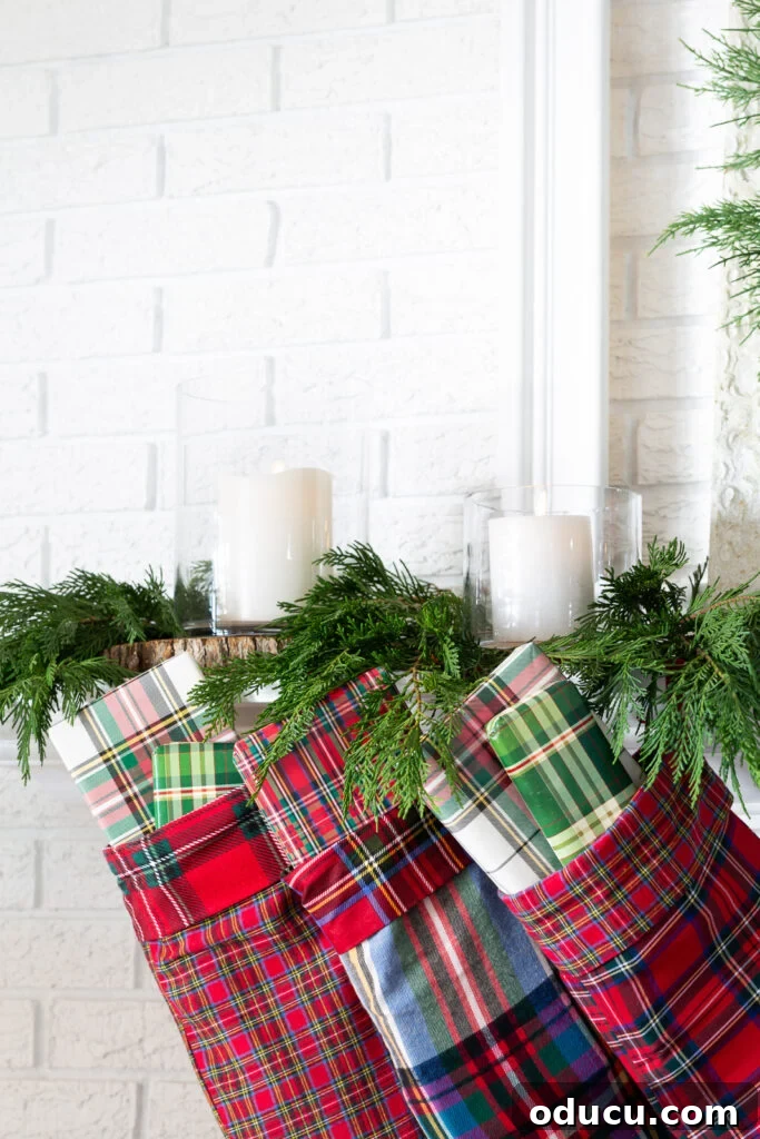 Decking the Halls for the Holidays 7 plaid Christmas stockings hanging from a mantel.