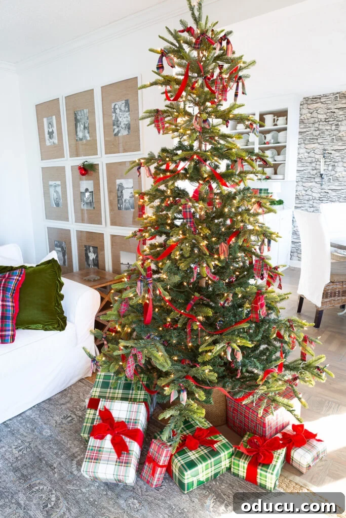 Decking the Halls for the Holidays 9 Simply decorated Christmas tree using strips of plaid fabric and red velvet ribbon.