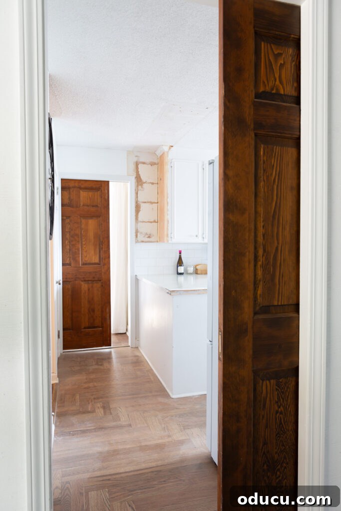 My Kitchen's Stunning Spacious Makeover 15 Kitchen view from foyer with pocket doors partially visible, illustrating flexible spatial closure.