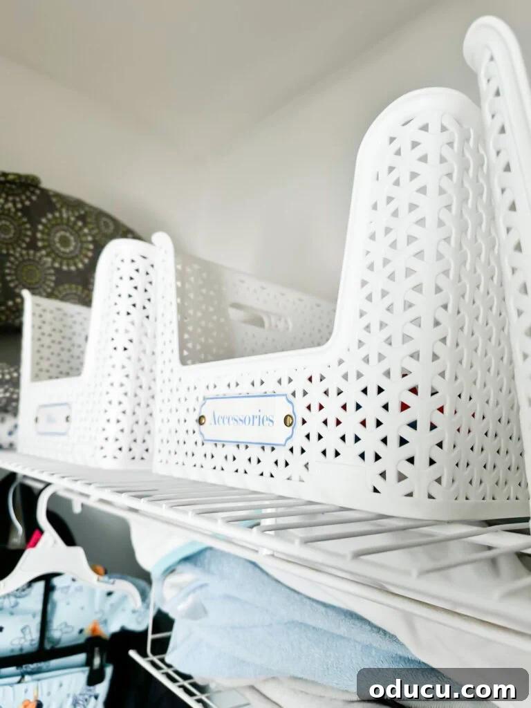 Elevate Your Nursery: Printable Basket Labels for Stylish Organization 9 Well-arranged closet shelves in a baby nursery, optimized with custom labels for each storage basket