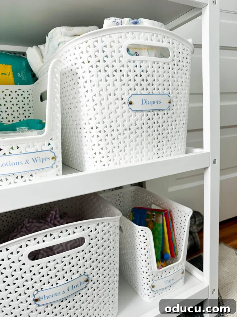 Elevate Your Nursery: Printable Basket Labels for Stylish Organization 10 Thoughtfully organized baby changing area with decorative and functional storage basket labels
