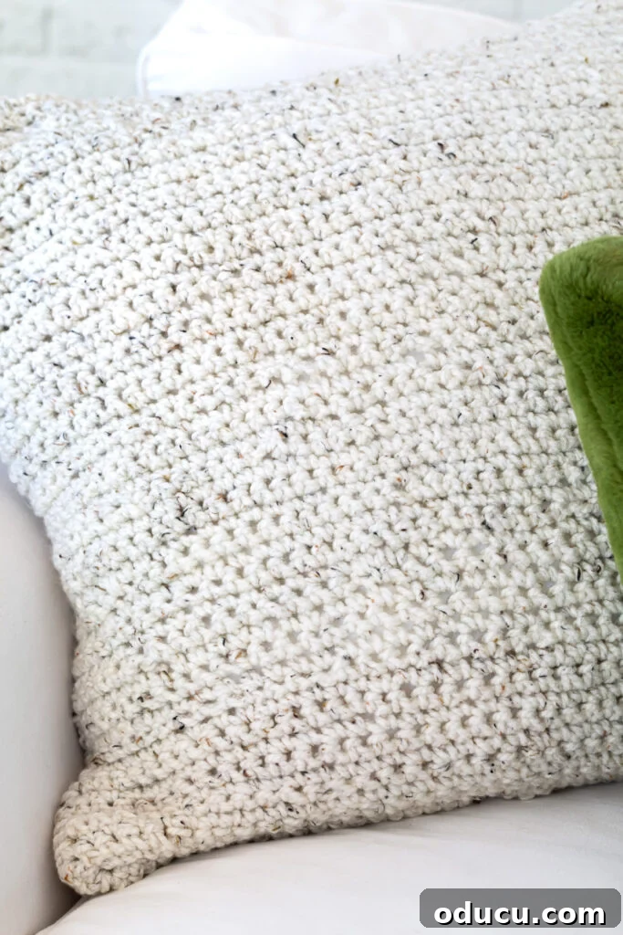 My Analog Carry: Intentional Essentials for an Offline Life 7 Close up the crocheted pillow cover on sofa.